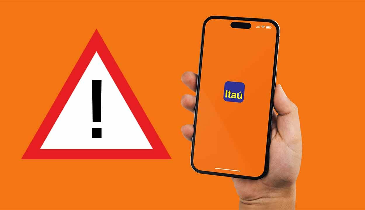 Imagem de uma mão segurando um celular com a tela na logo do Itaú. Ao lado, uma placa com o símbolo da exclamação