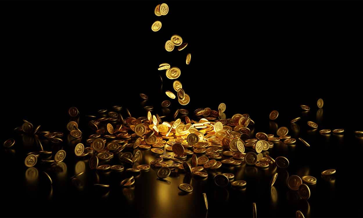 Moedas douradas caindo e se espalhando