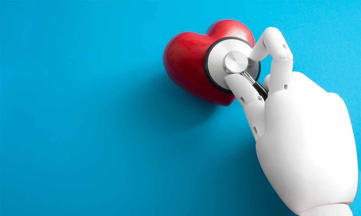 Mão robótica examina coração de borracha