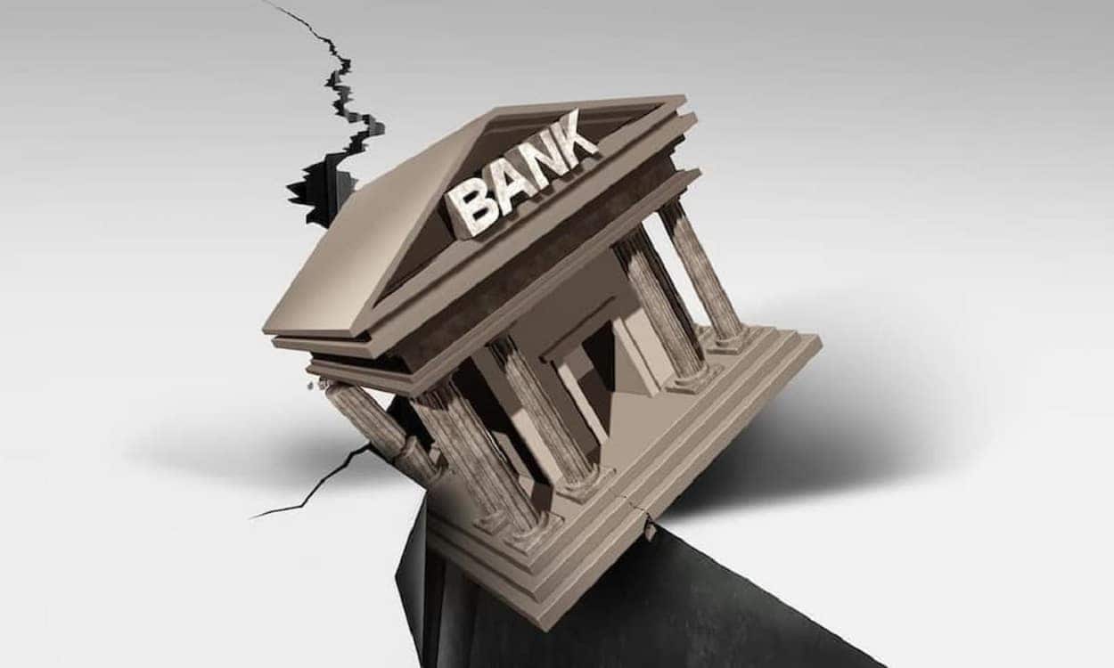 Representação de banco caindo em grande rachadura no chão