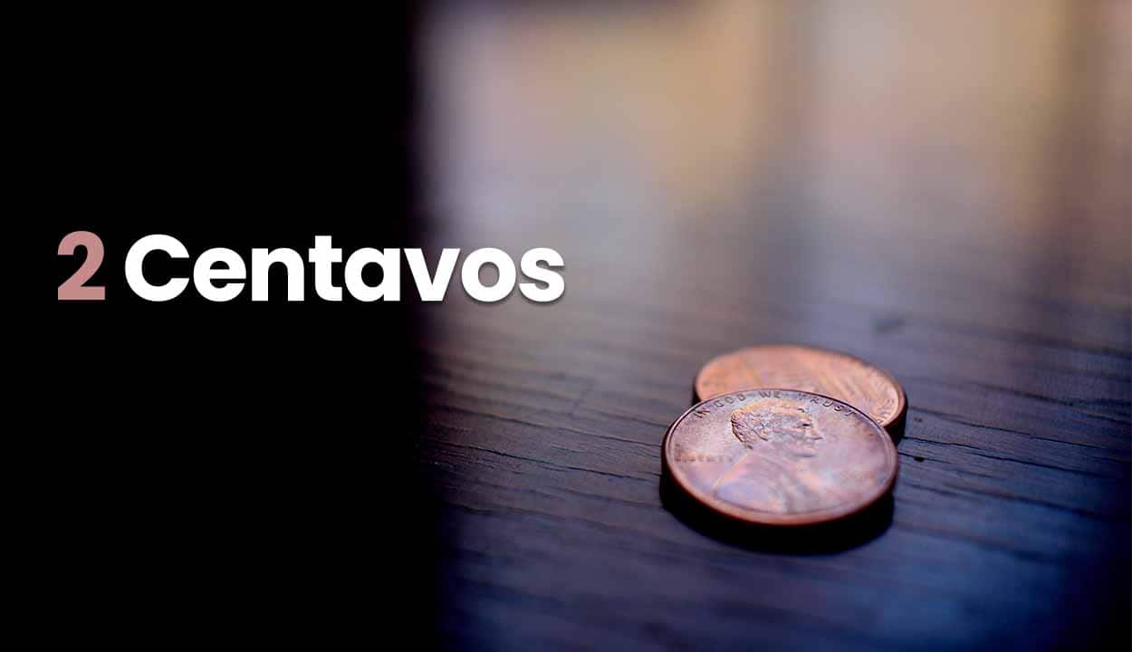 Imagem de duas moedas sob uma mesa, com um fundo escrito "2 centavos"