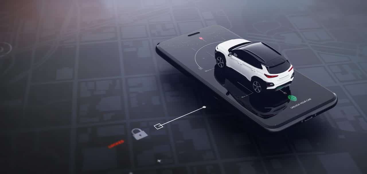 Miniatura de um carro branco em cima de um aparelho celular