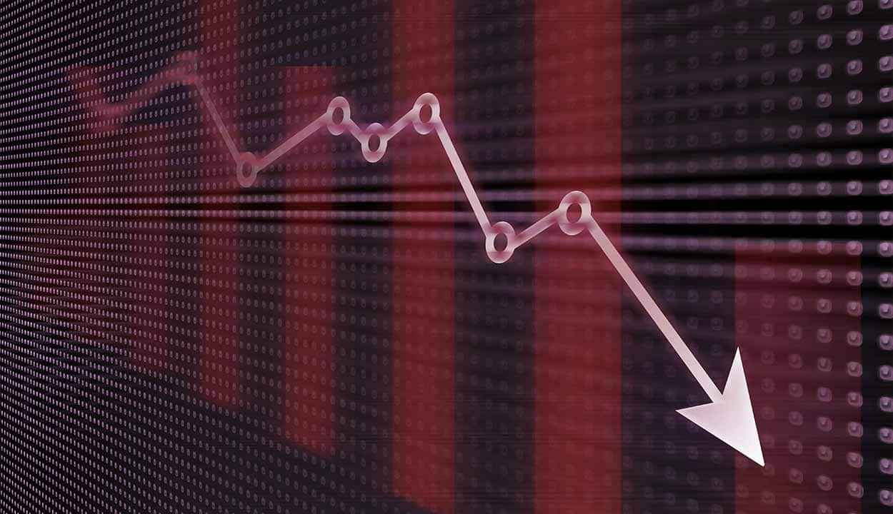 Seta de gráfico em queda sobre fundo vermelho