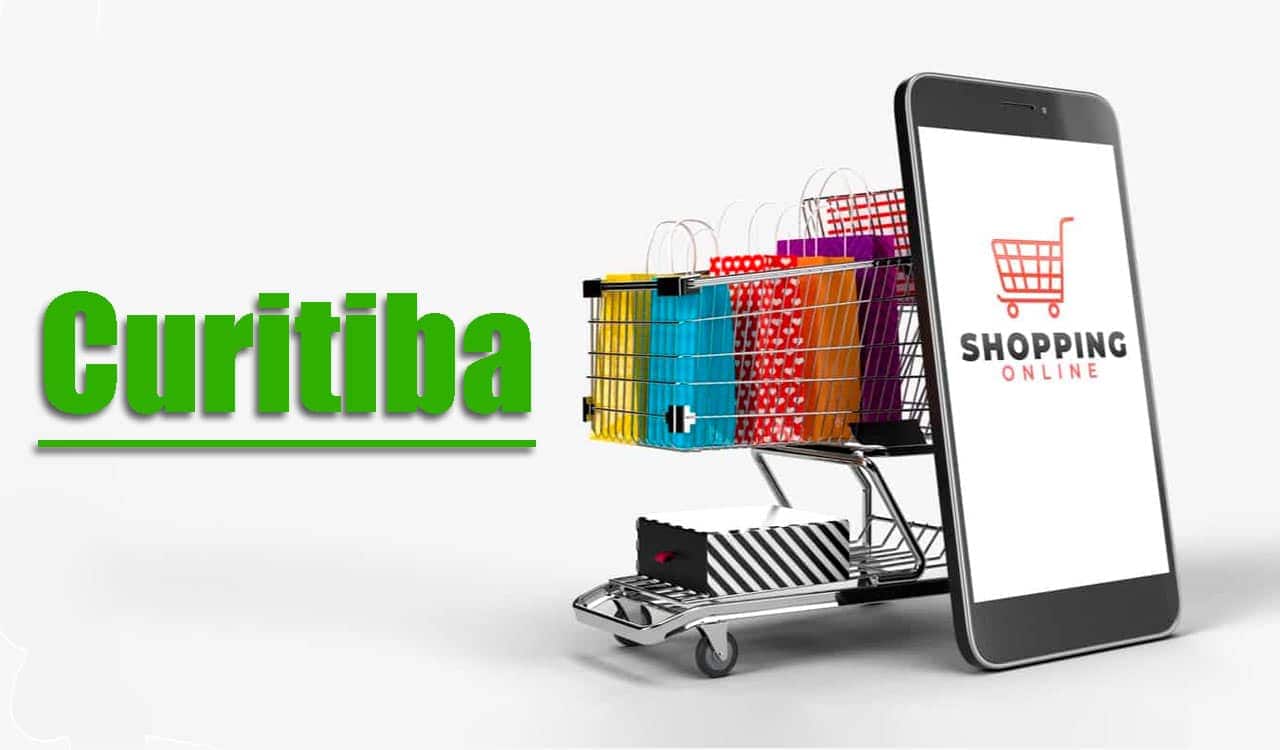 Imagem de um carrinho de compras ao lado de um celular aberto em um aplicativo de compras on-line.