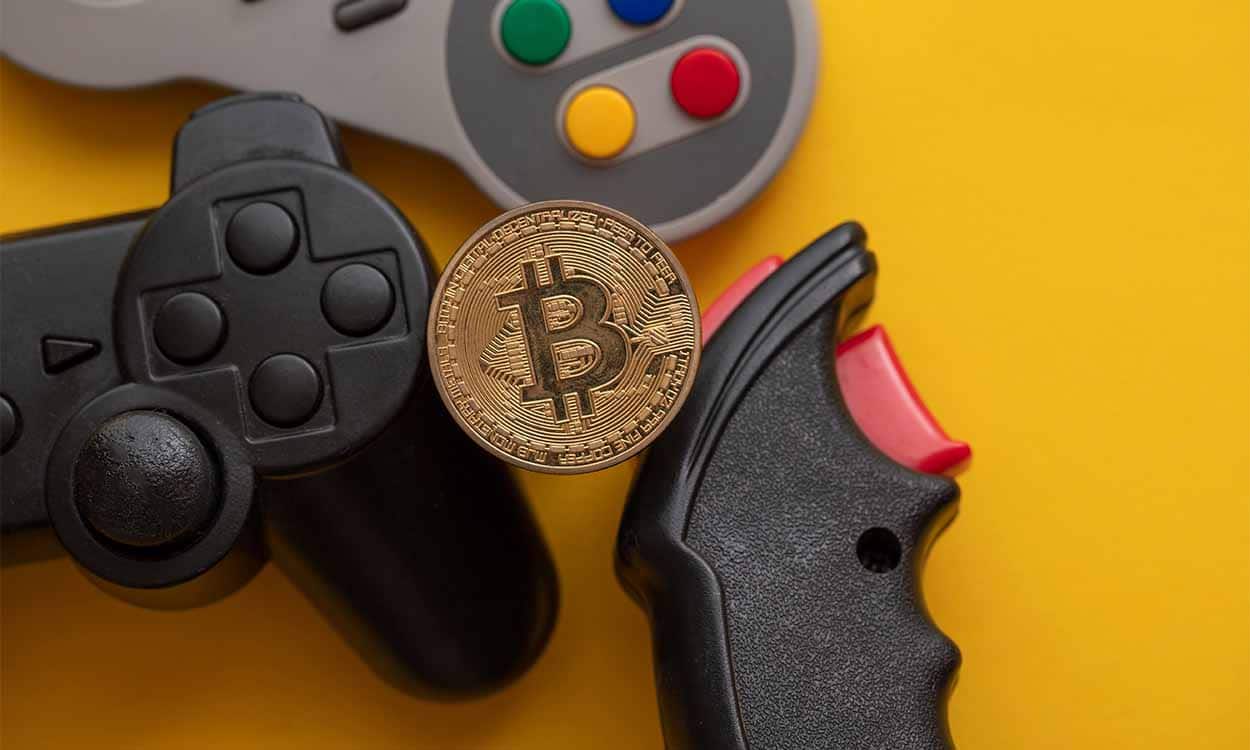 Imagem com Bitcoin e controles de videogame em volta