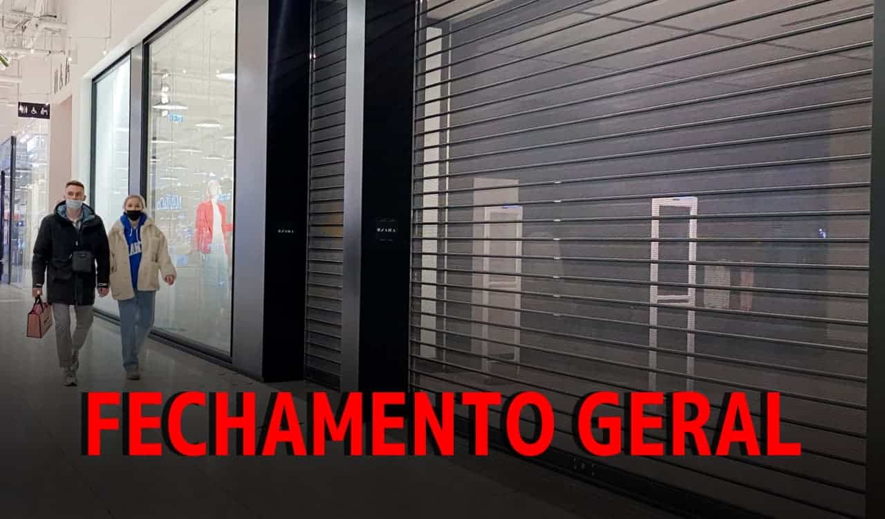 Portas de agência fechadas com duas pessoas passando à frente. Em fonte vermelha "Fechamento geral".