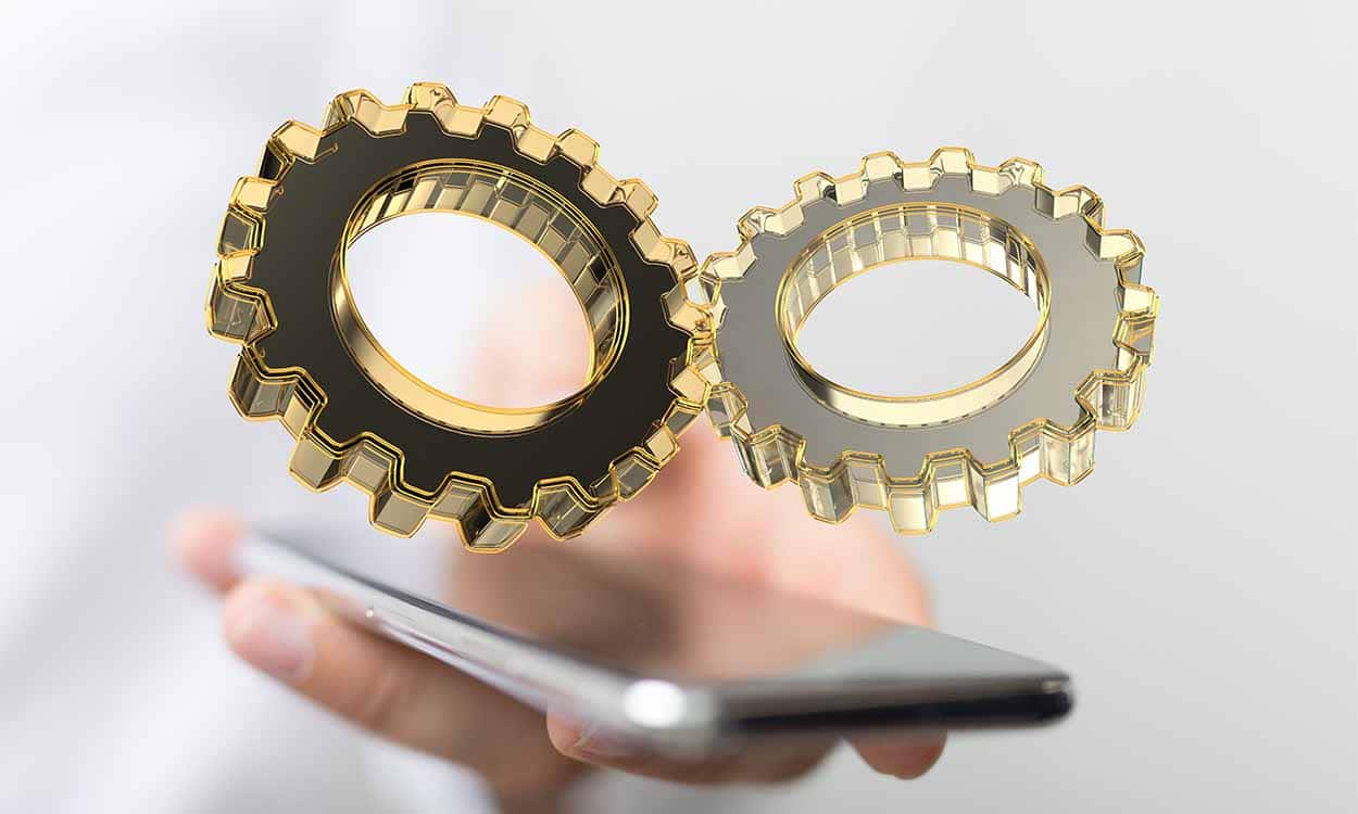 Símbolo de engrenagem em cima do celular