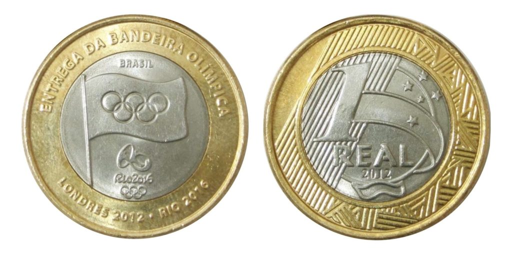 A moeda da bandeira olímpica não foi lançada em nenhum lote distribuído entre 2014 e 2016. Esse modelo é o mais antigo, lançado em 2012, e representa a passagem da bandeira dos Jogos Olímpicos de Londres para o Rio de Janeiro