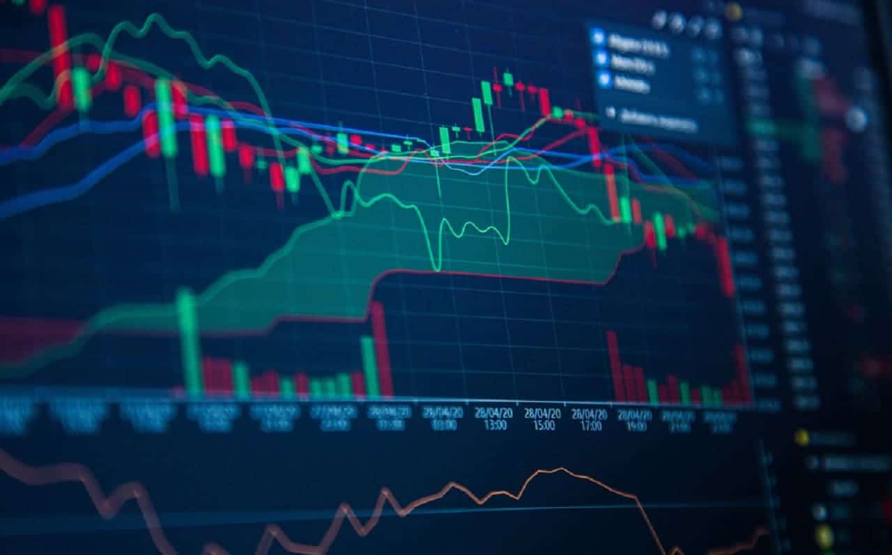 Um tela preta com imagens referentes aos gráficos do mercado financeiro