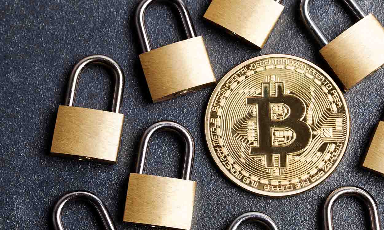 Cadeador dourados ao redor de moeda Bitcoin