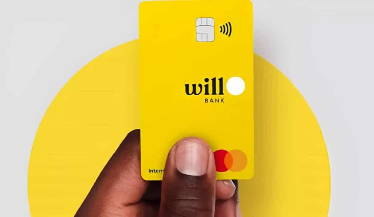 Mao segurando cartão do Wiil Bank